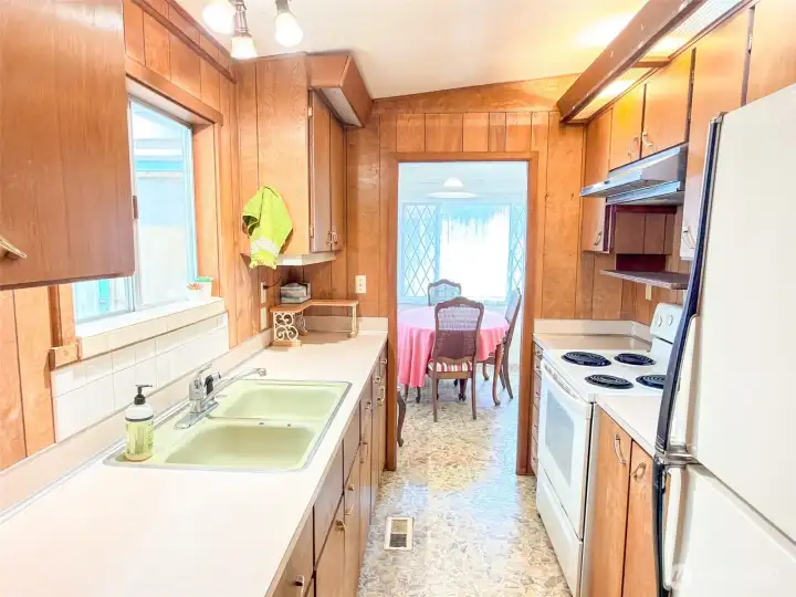 From the utility end of the kitchen toward the dining area.