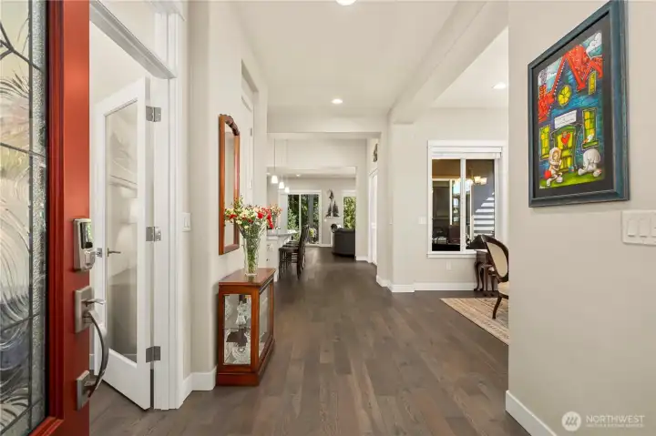 You will immediately be impressed as you open the beautiful glass front door into the generous entry welcomes you into this highly sophisticated and meticulously maintained home. Extensive Engineered hardwoods, upgraded baseboards & window wraps, rounded corners, surround sound, 10' ceilings & 8' doors, French doors into the den/office or third bedroom spillover.