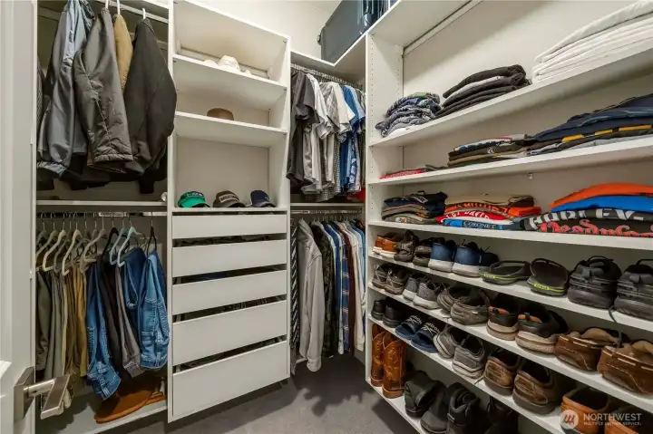 One of two walk-in closets with custom built-ins.