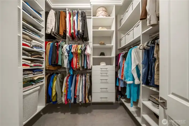 The other walk-in closet in the primary suite, also with custom built-ins.