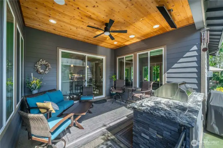 Truly and extension of the home, with a raised patio, ceiling fan, surround sound, Bromic heaters and the stained wood ceiling. This outdoor kitchen will make entertaining so much fun!