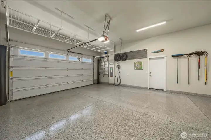 Fully finished 3 car garage offers overhead storage, a convenient man door, battery back-up for the garage door and epoxy floors. There are also custom mats (rolled up in the corners) that the seller will be leaving for under two (large) cars.