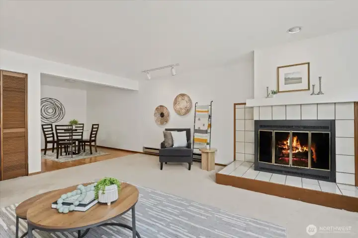 The dining room opens to the light and bright living room complete with a fireplace for cozy winter nights.