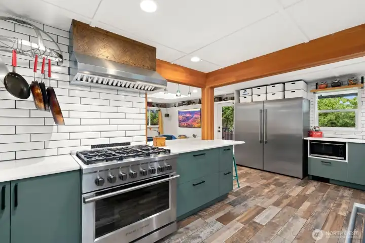 Gas Stove and a real hood vent mean you are ready to cook!  (Note, this gas stove to be replaced by owner prior to closing).