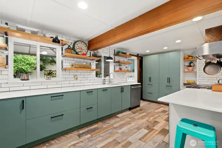 Don't miss the amazing antique sliding barn door (can you tell where it's from?) that separates the laundry room and rear entrance from the rest of the house.