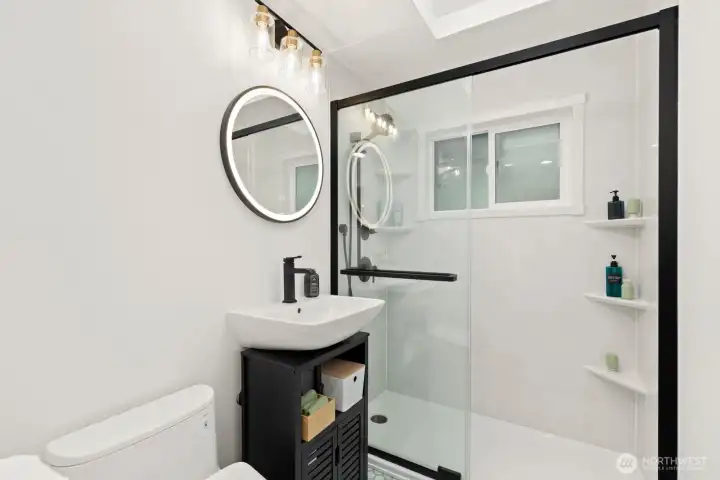 Splish-Splash!  This fully renovated bathroom is ready to get wet - water-resistant walls in every direction!