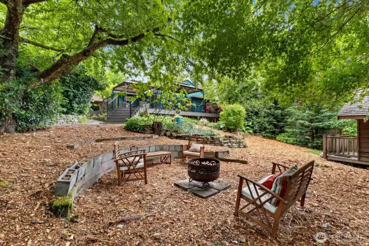 Cool off in the shade and enjoy some quiet moments around the fire pit.  Sing camp songs and eat s'mores!  (Also, a trampoline could fit here... Just sayin'...)