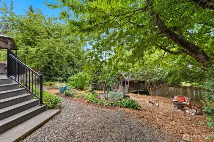 Gravel paths lead you through a wonderland full of potential. Plant flowers or veggies.  Play fetch with your dog.