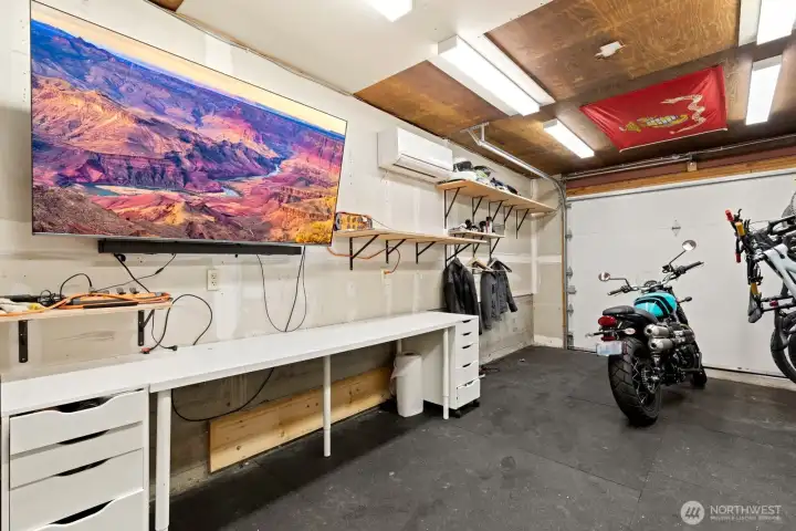 Do you have a garage hobby?  Maybe cars, bikes, or motorcycles?  This garage space is very pleasant with drywall, lighting, work bench and mini-split HVAC for heating and cooling.  Come on in, and stay a while!