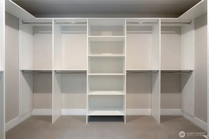 Primary bedroom walk in closet