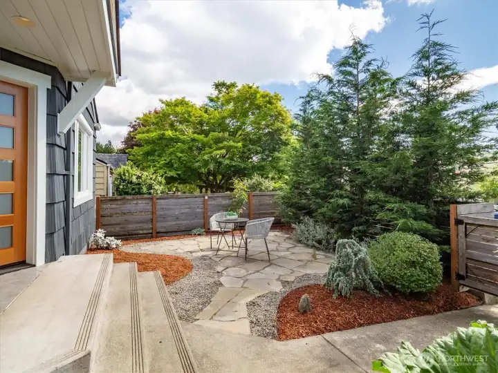 The front yard has a European vibe.
