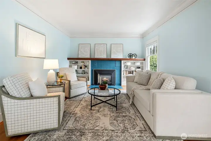 Living Room with timeless charm and original fireplace with gas insert. Living Room with timeless charm and original fireplace with gas insert.