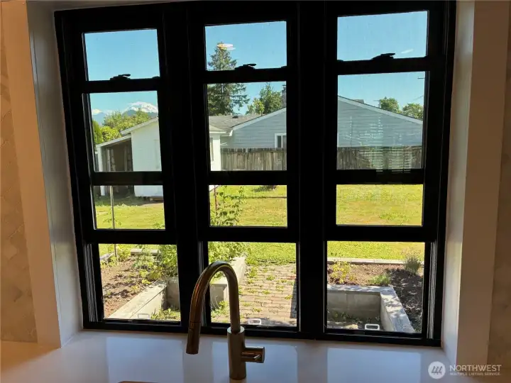 A wonderful view of the mountain and the backyard while looking through these gorgeous double hung windows A wonderful view of the mountain and the backyard while looking through these gorgeous double hung windows