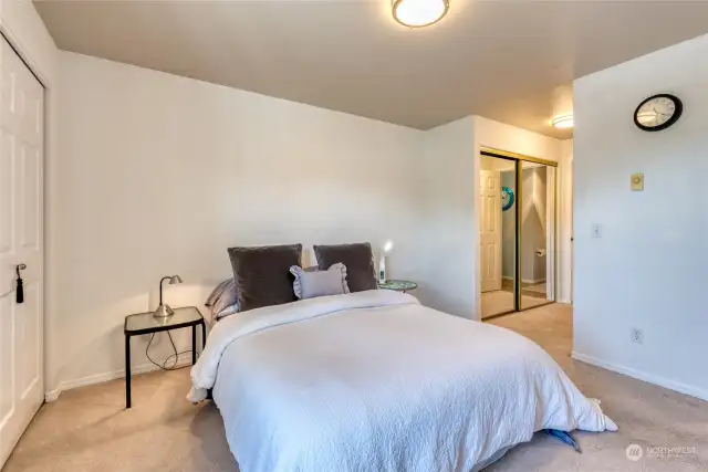 Retreat to your primary bedroom with dual closets and windows perfectly framing beautiful mountain and city views.