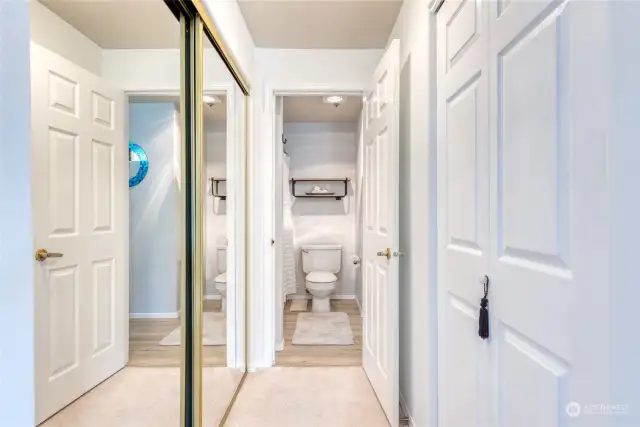 Primary bedroom with dual closets on each side has easy access to the full bathroom.