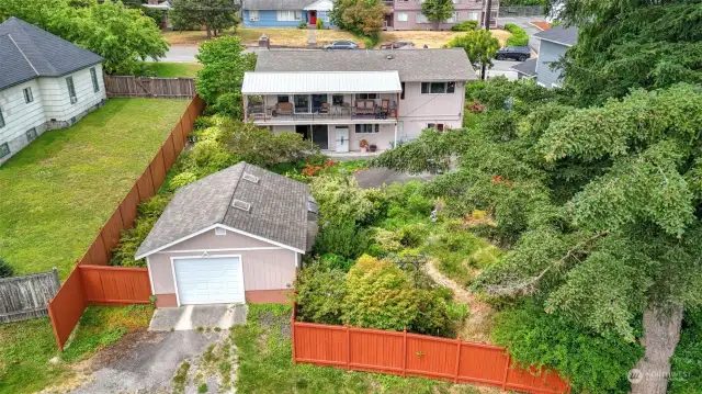 Back of home. Detached garage offers parking for 1 car and additional workspace.