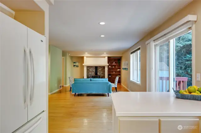 A view from the kitchen flowing into the casual living area.