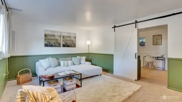 Enjoy the barn door in this bonus room to close off from the guest space just steps outside.