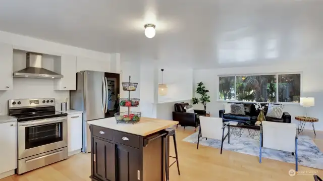 Easy hosting at meal time with open sight lines from this kitchen to the living and dining room.