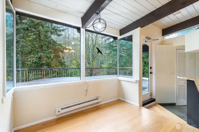 Eating area in kitchen looking out over deck