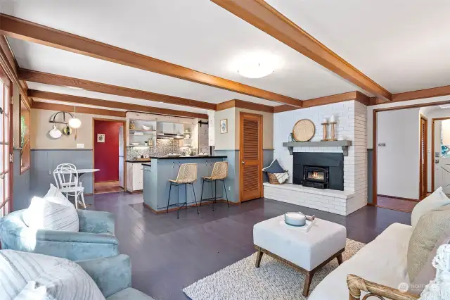 Kitchen is open to a cozy family room with wood burning fireplace