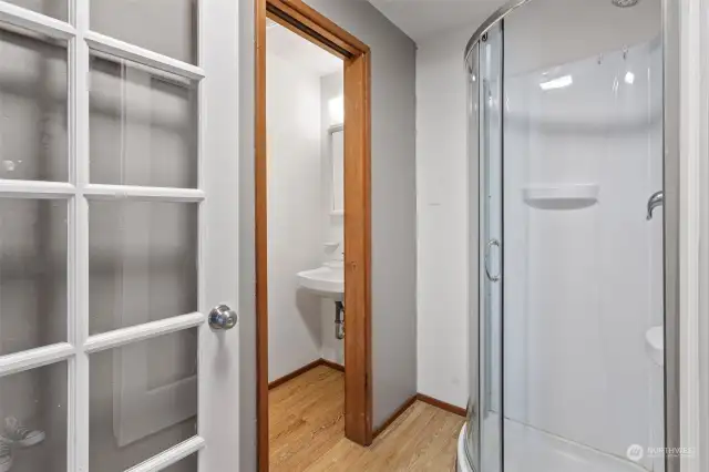 Three-quarter bathroom with shower is off the laundry room