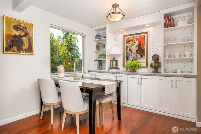 Dining area with built-in cabinets.