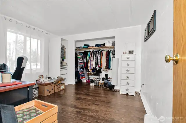 Bedroom 2, currently set up as an office, features newer laminate flooring that makes it easy to move around—whether you’re working or relaxing.