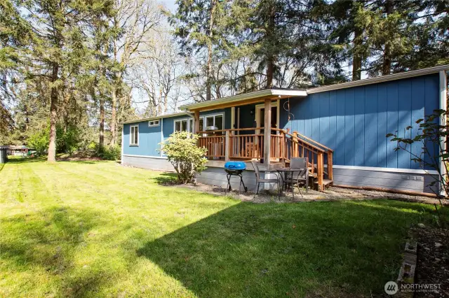 The spacious yard overlooks a lovely playground, perfect for kids or anyone who enjoys having some lively activity nearby. This wonderful all-ages park offers fun and energy right outside your door.