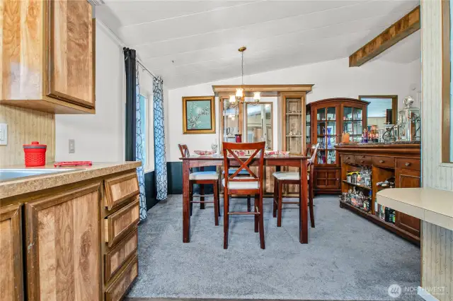 The dining room is conveniently located just off the kitchen, making mealtime a breeze—from prep to serving. A built-in cabinet adds a charming touch and is perfect for showcasing your favorite dishes or storing special keepsakes.