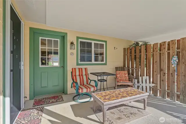 Cute enclosed patio at rear of home...