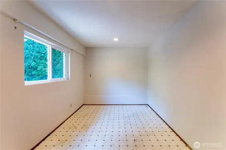 Converted garage space, also perfect for an office or kids room.