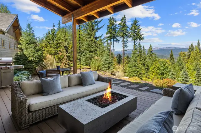 This covered patio creates a luxurious extension of the living space, showcasing the views in every season.