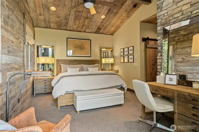 The primary suite balances rustic warmth with elegant details, creating a space of pure sophistication.