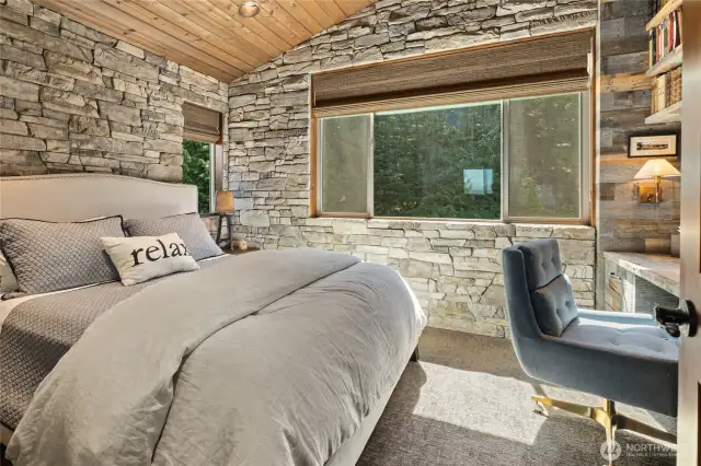 This upper-level guest room feels like a charming old-world hideaway.