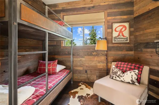 A hidden gem of the home is the bunkroom located along the breezeway to the garage.