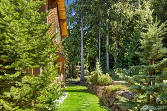Meticulously crafted landscaping complements the mountain surroundings, making this setting truly exceptional.
