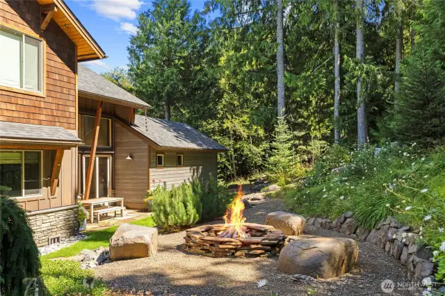 Perfect for entertaining, the cozy backyard firepit brings friends and family together.