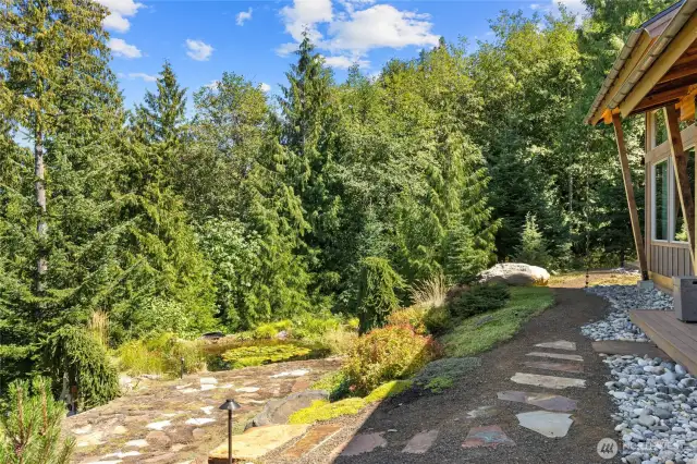 Enjoy a private pond on the property, complete with a small, recirculating stream.