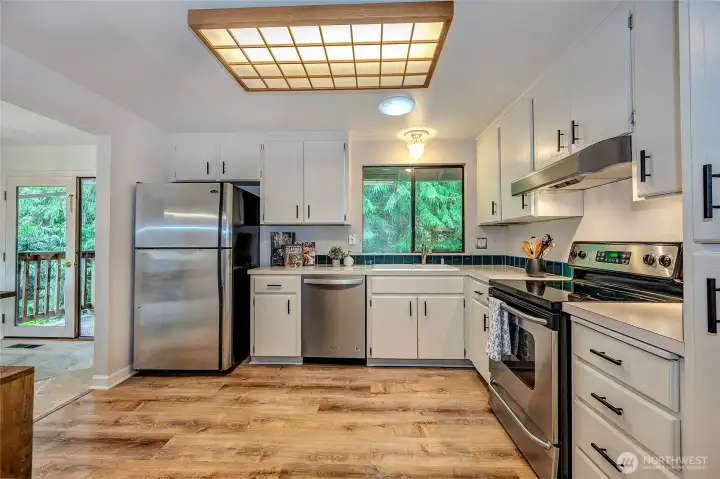 Large Kitchen With Stainless Appliances. New Kitchen Flooring.