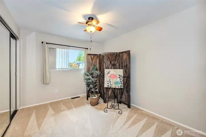 2nd Bedroom Upstairs. New Carpet and Mirrored Closet Doors.