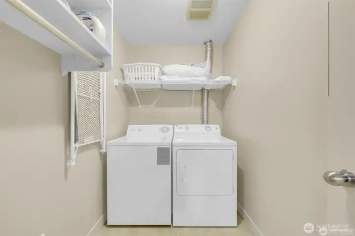 Spacious utility room with a full-size washer/dryer—laundry made easy!