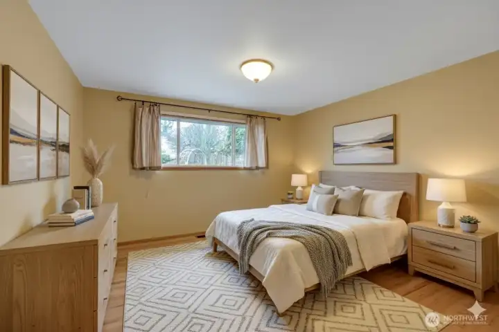 One of three bedrooms all with hardwood floors.