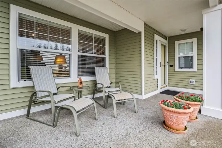 A covered front patio provides plenty of room to relax.