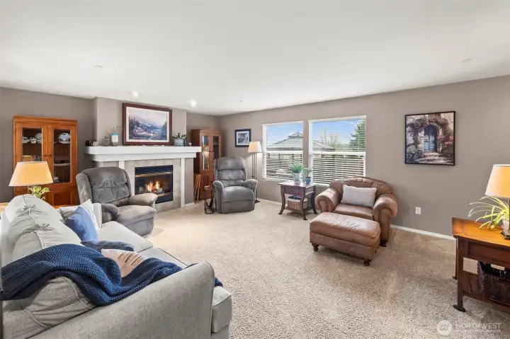 Step inside to a spacious living room with great natural lighting. The gas fireplace has been serviced.