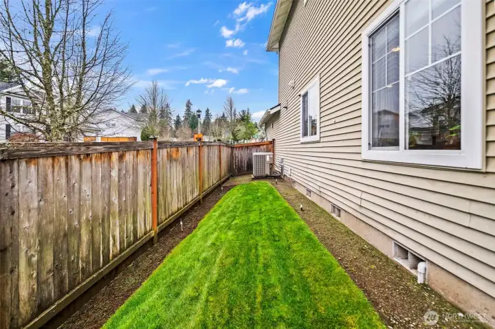 This side yard gets lots of sunlight! It previously held a raised garden and would love to host a new garden.