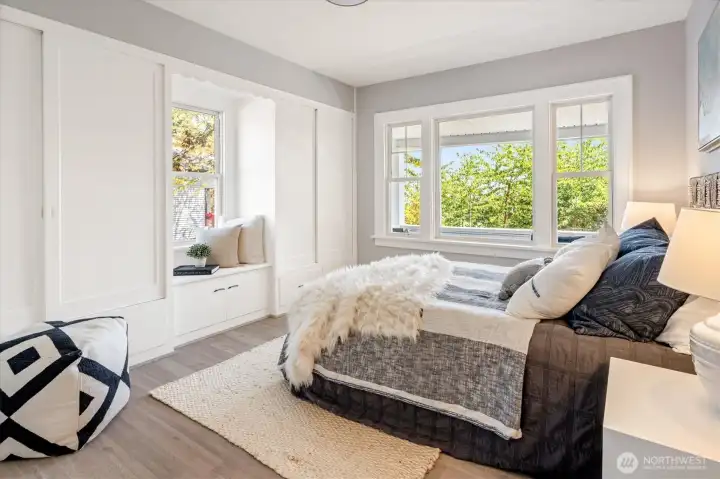 Main level bedroom offers period built-in cabinetry, window seating, and a deep walk-in closet. Photos from earlier listing in 2025.