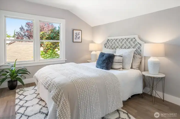 Primary bedroom offers calm and ease with an ensuite bath, walk-in, and discreet storage. Photos from earlier listing in 2025.