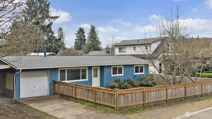 Three bed/one bath rambler with one car garage, attached carport.