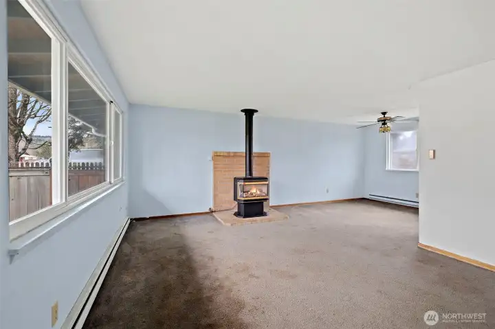 The free-standing stove fireplace brings coziness on chilly, PNW evenings.